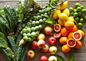 a group of fruits and vegetables on a wood surface Healthy Weight Loss Diets Heath